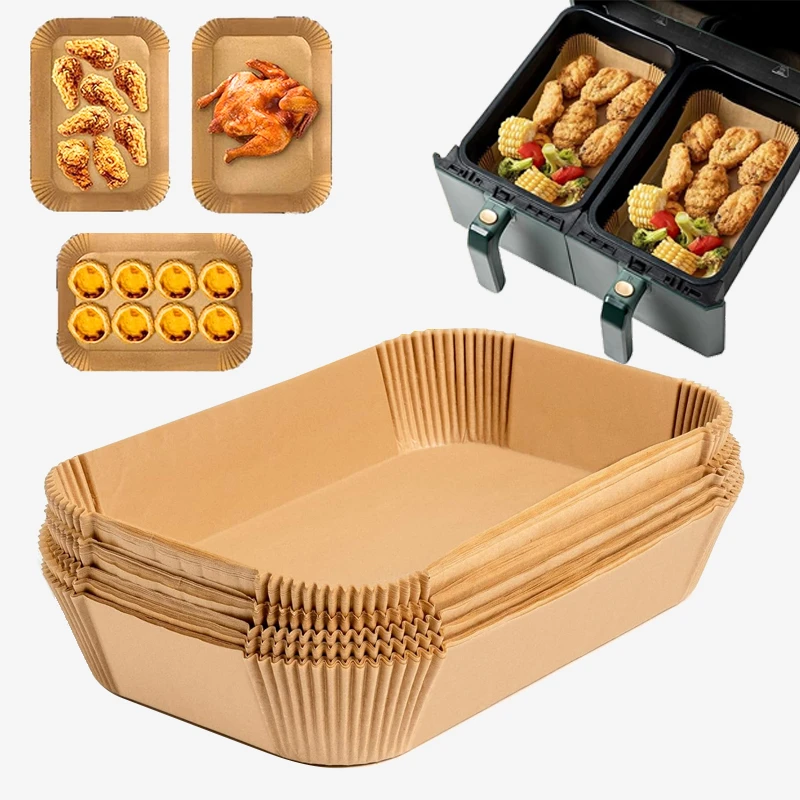 Rectangle parchment paper air fryer liners in a dual-basket air fryer with cooked food