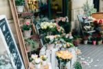 Flower shop with assorted bouquets ready for kraft paper basket bag packaging