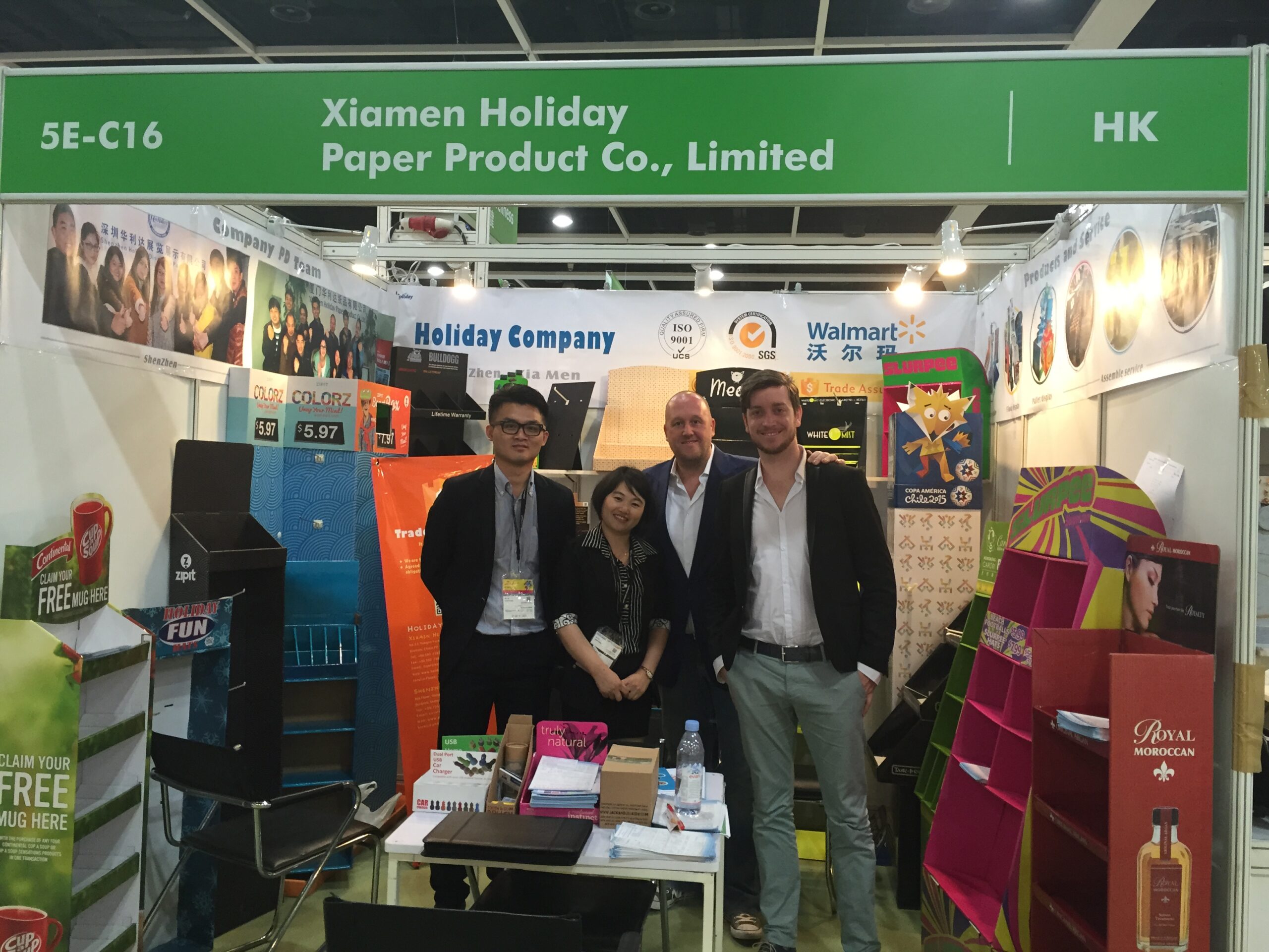 Holidaypac sales team meeting B2B buyers with custom cardboard POP display samples at Hong Kong trade fair