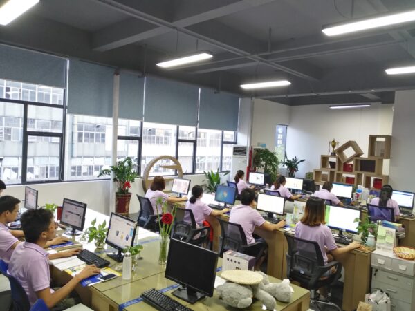 Holidaypacfactory modern office with design team working on custom picnic boxes and food packaging