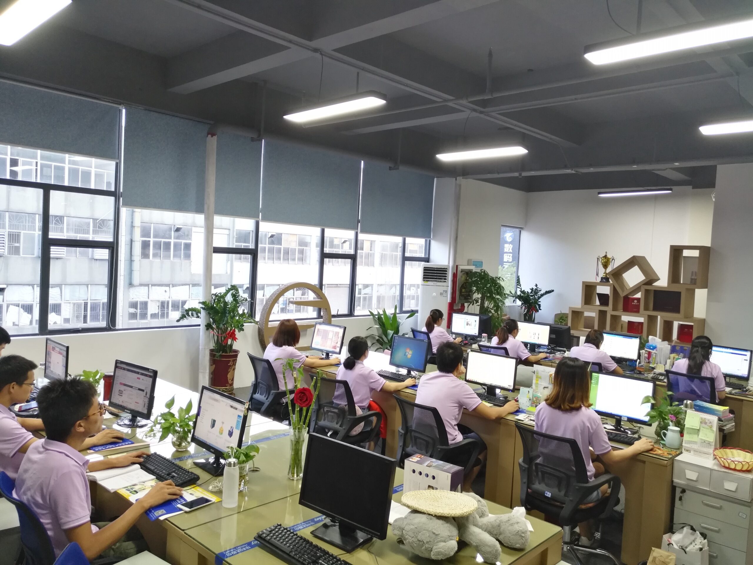 Holidaypacfactory modern office with design team working on custom picnic boxes and food packaging
