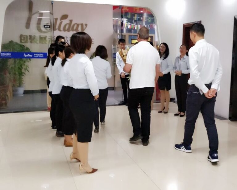 Holidaypac factory team welcoming international packaging buyers at Ningbo showroom