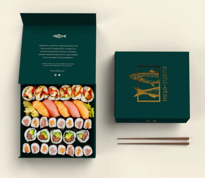 Top view of premium green sushi take away box with sashimi maki rolls and wooden chopsticks - luxury sushi packaging design