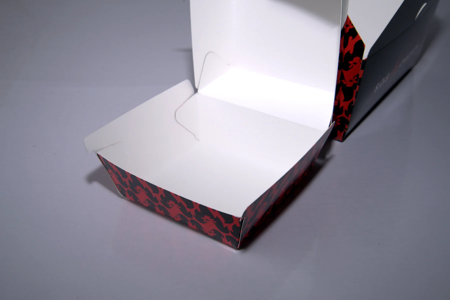 Holidaypacfactory holidaypac factory custom chicken takeaway packaging case study The interior bottom detail helps confirm usable food space and fold cleanliness.