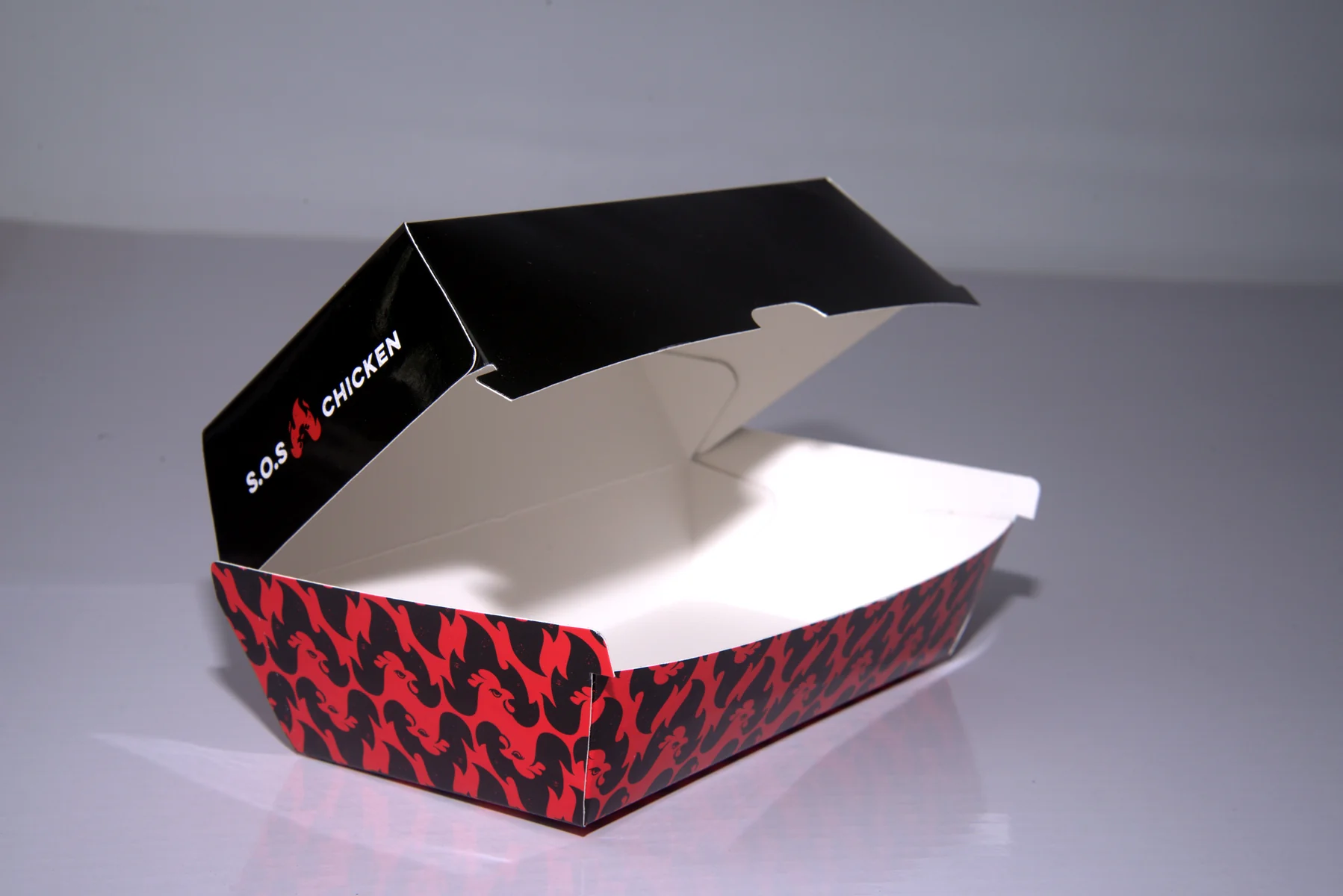Holidaypacfactory holidaypac factory custom chicken takeaway packaging case study The white interior keeps the food area clean and easy to inspect before packing.