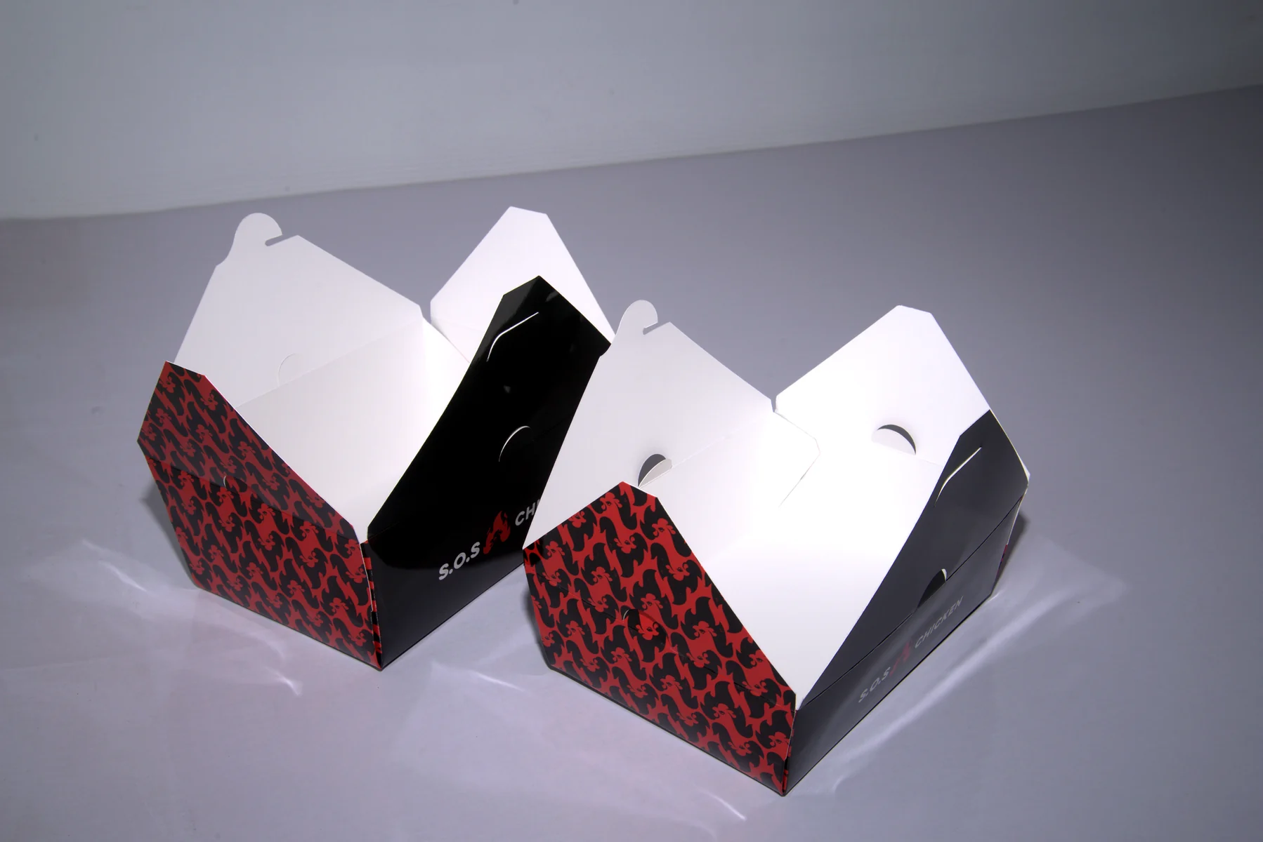 Holidaypacfactory holidaypac factory custom chicken takeaway packaging case study Two open samples compare the same structure from different opening positions.