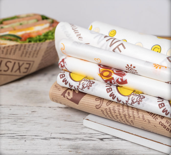 Holidaypacfactory custom printed greaseproof wrap paper rolls stacked for foodservice use
