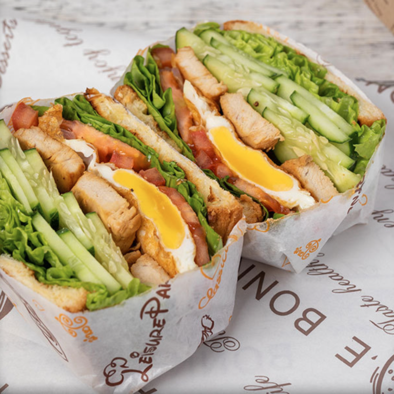 Holidaypacfactory custom printed sandwich wrap paper sheets in stacked presentation
