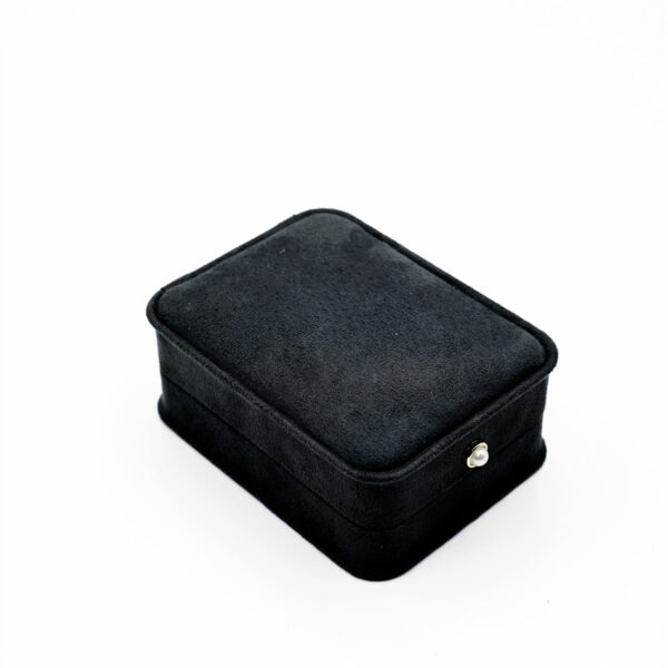 Black suede magnetic jewelry box closed angle view
