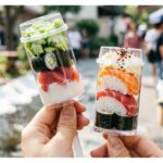 custom sushi push pop paper tube packaging with clear plunger cup for restaurant takeaway Holidaypacfactory image 1