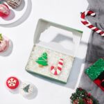 Christmas cookie bakery boxes with window Holidaypacfactory real Christmas packaging scene image 3 for holiday bakery, cookie gift and seasonal food retail