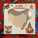 Christmas cookie bakery boxes with window Holidaypacfactory real Christmas packaging scene image 4 for holiday bakery, cookie gift and seasonal food retail