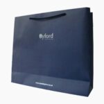 custom kraft paper bag with handles Holidaypacfactory image 4 for apparel, cosmetics, gifts, grocery items, bakery products, retail purchases, event packs and branded shopping bags