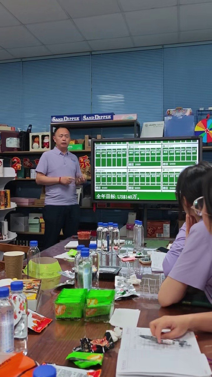 Holidaypacfactory presenter reviewing packaging project data during mid-year meeting