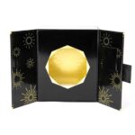 black folding perfume box opened at an angle with gold interior insert Holidaypacfactory