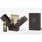 closed middle open perfume gift box with black exterior and gold badge Holidaypacfactory