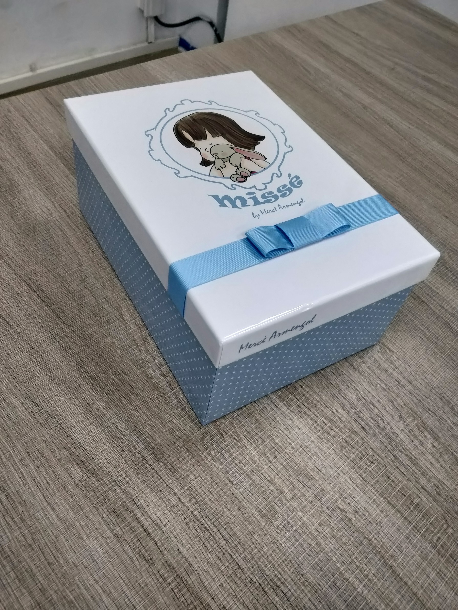 Custom rigid doll gift box with white printed lid and blue ribbon bow