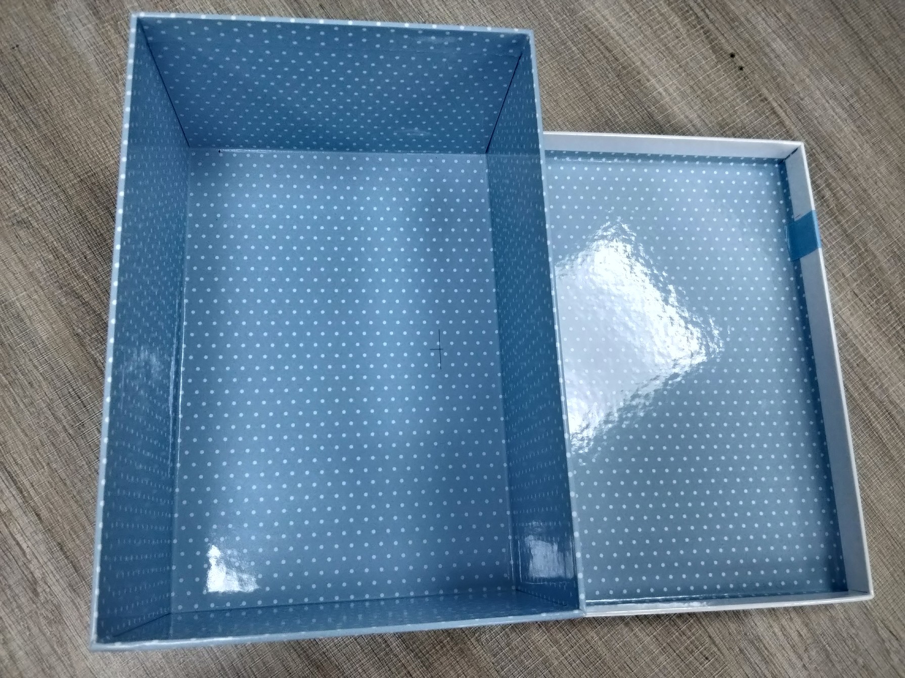Wrapped rigid gift box lid with custom character artwork and ribbon decoration
