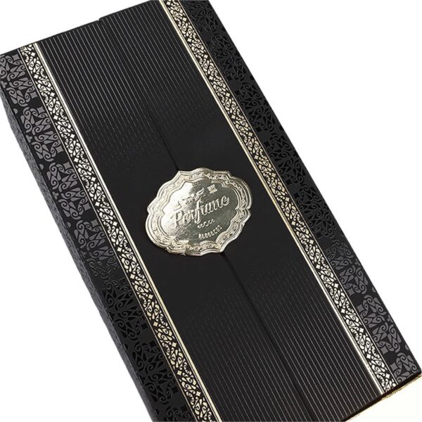 close detail of black perfume packaging box with gold border and patterned wrap Holidaypacfactory