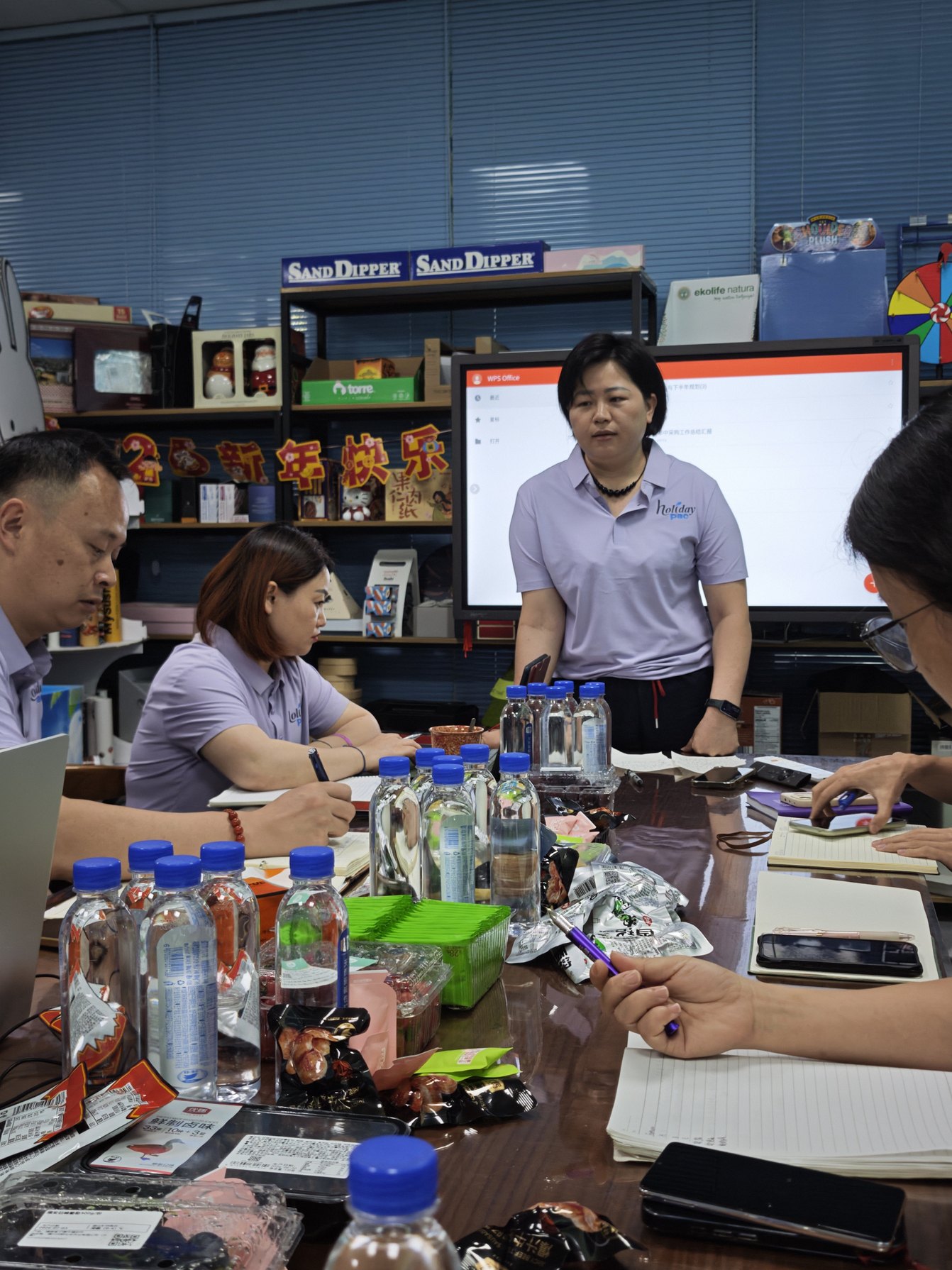 Holidaypacfactory team discussing custom packaging project progress