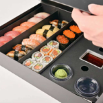 black sushi gift box divided tray with sushi and sauce cups Holidaypacfactory
