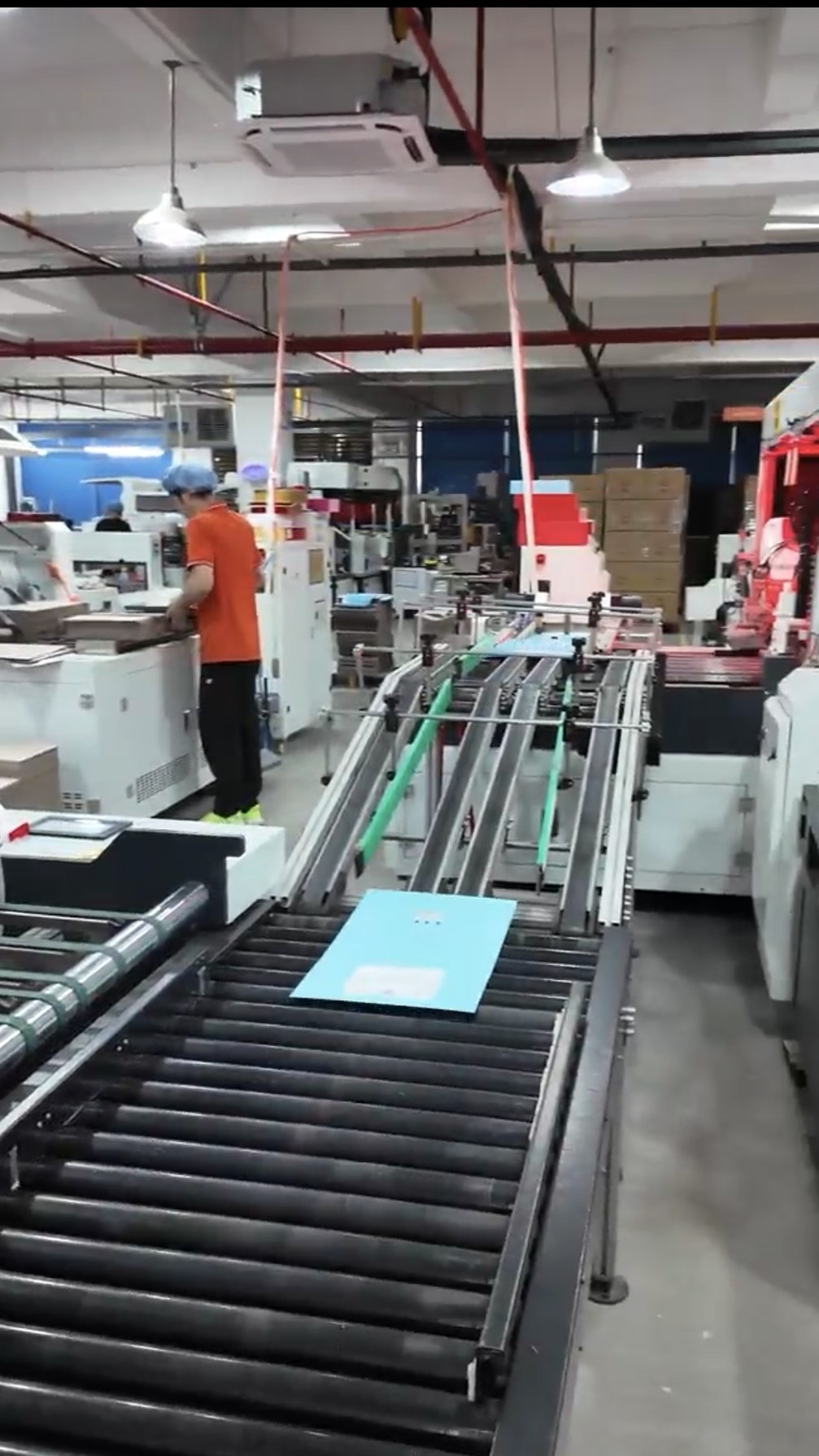 Holidaypacfactory production floor with conveyor equipment and packaging materials
