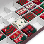 Christmas advent calendar sock compartments filled with holiday socks Holidaypacfactory