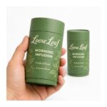 custom green kraft paper tube packaging held in hand Holidaypacfactory